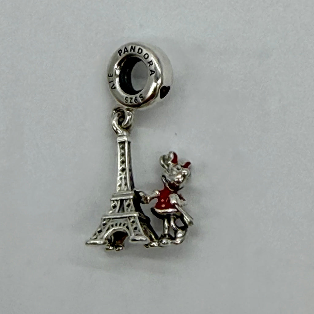 Disney Parks Pandora Silver charm with Eiffel Tower and Minnie Mouse on a gray background